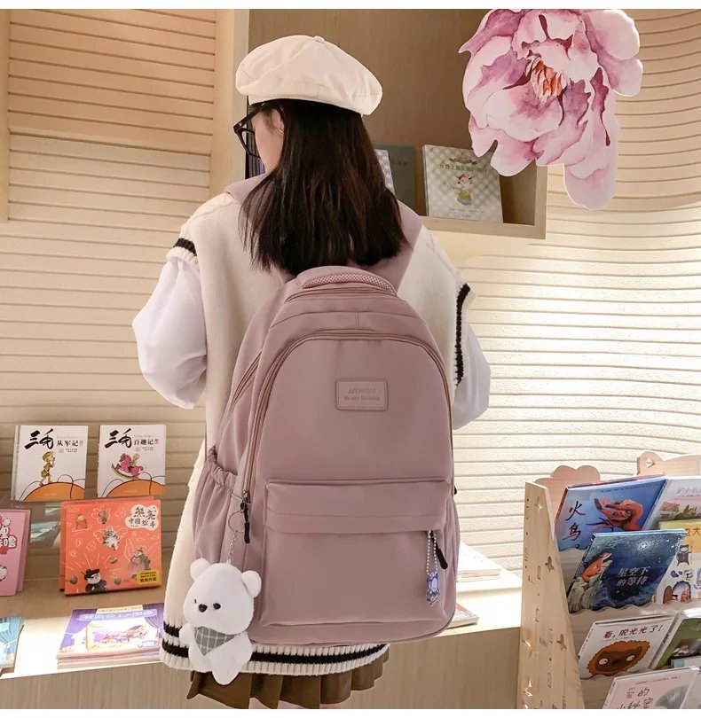 Student Japanese large-capacity backpack Girl simple and versatile backpack Unisex polyester material Doll decoration