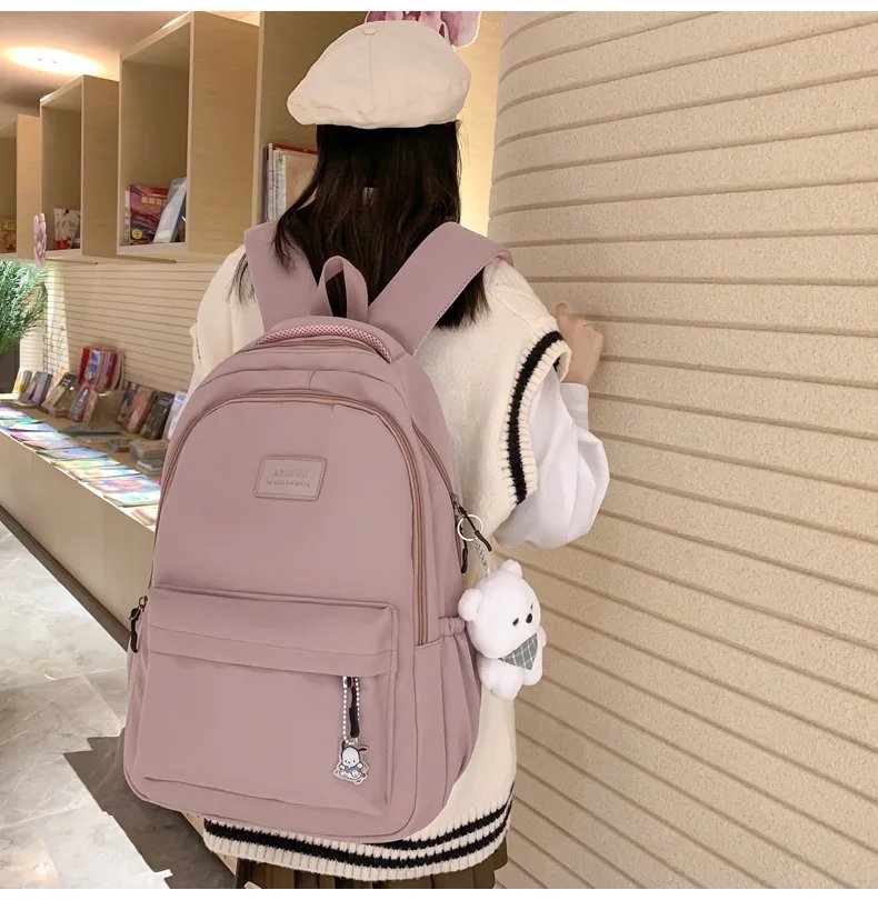 Student Japanese large-capacity backpack Girl simple and versatile backpack Unisex polyester material Doll decoration