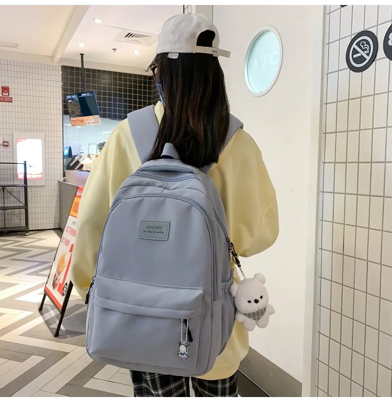 Student Japanese large-capacity backpack Girl simple and versatile backpack Unisex polyester material Doll decoration