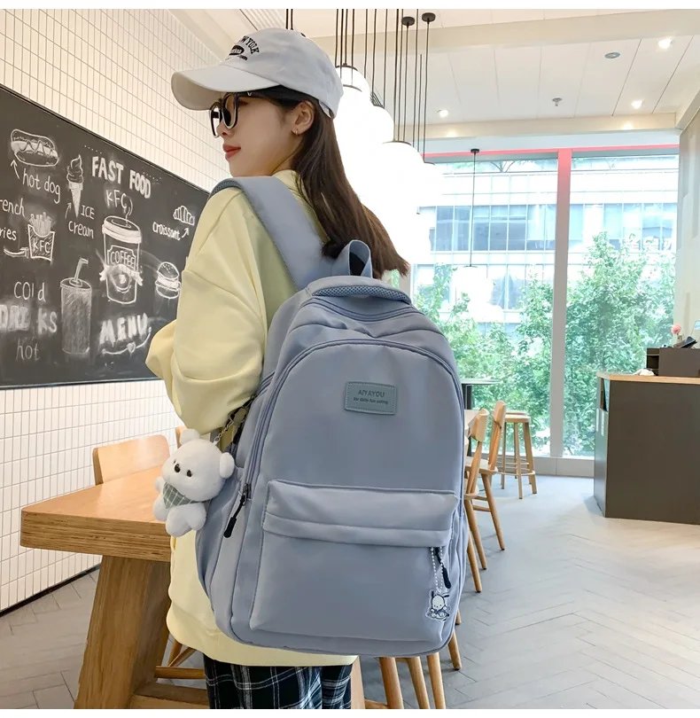 Student Japanese large-capacity backpack Girl simple and versatile backpack Unisex polyester material Doll decoration
