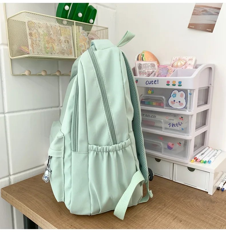 Student Japanese large-capacity backpack Girl simple and versatile backpack Unisex polyester material Doll decoration