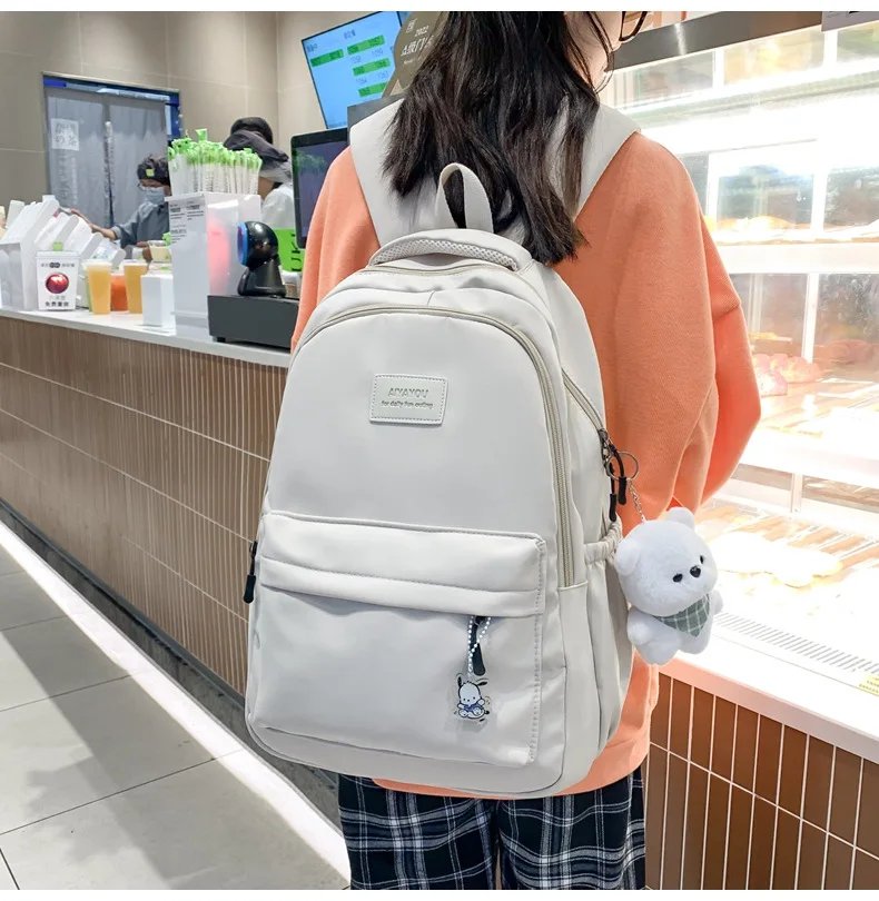 Student Japanese large-capacity backpack Girl simple and versatile backpack Unisex polyester material Doll decoration