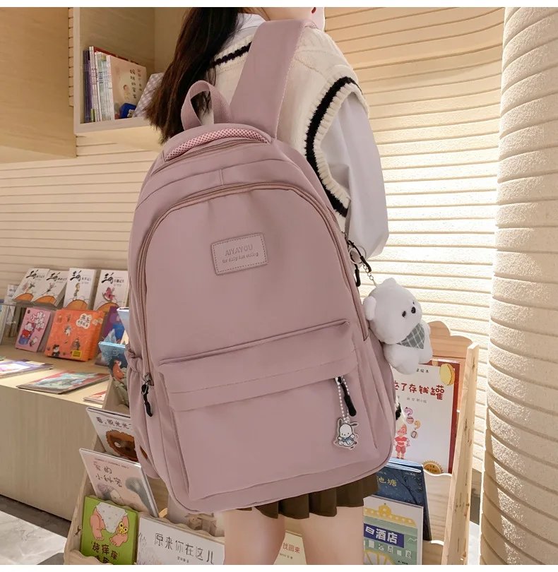 Student Japanese large-capacity backpack Girl simple and versatile backpack Unisex polyester material Doll decoration