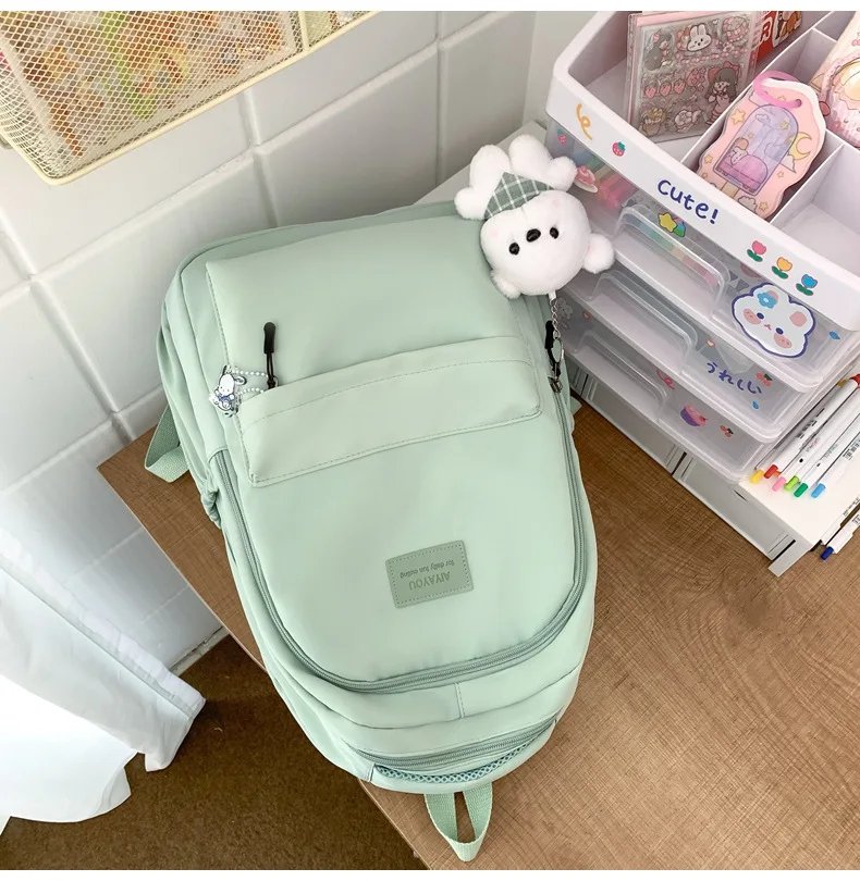 Student Japanese large-capacity backpack Girl simple and versatile backpack Unisex polyester material Doll decoration
